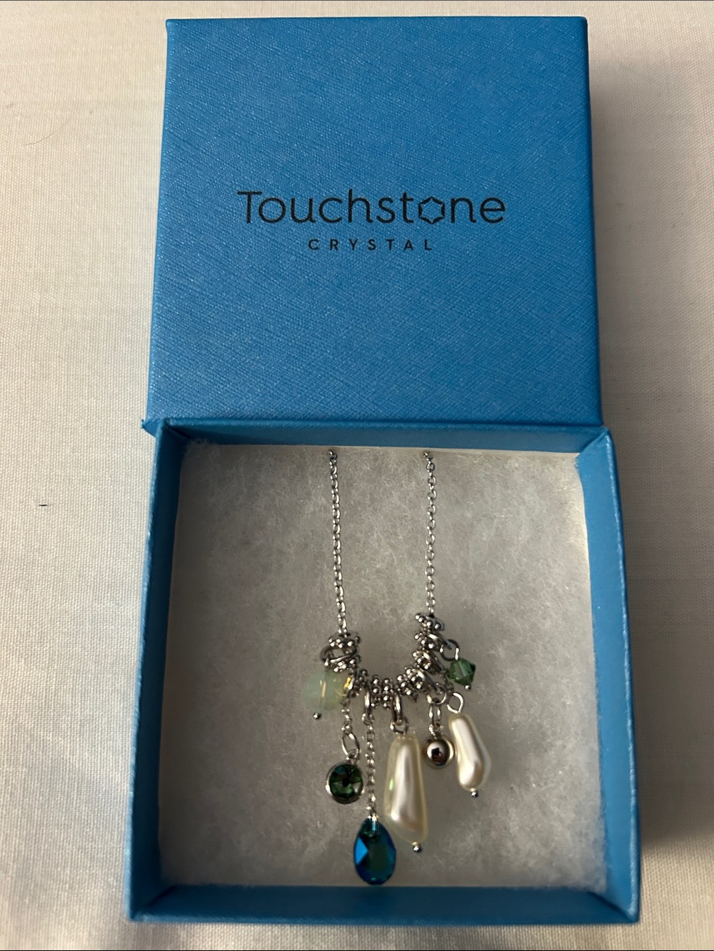 Touchstone Crystal mixed charm necklace with vibrant blue and green crystals